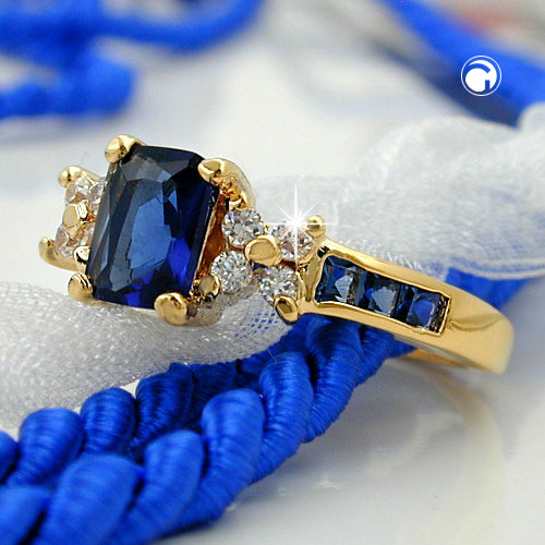 Bague dorée 3 microns avec pierre bleue et détails blancs
