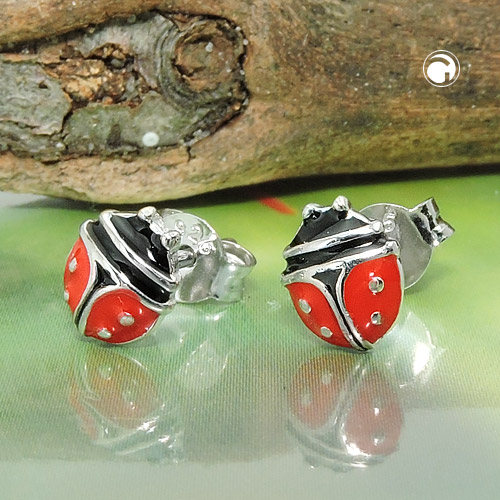 Boucles d'oreilles argent coccinelle portées sur oreille