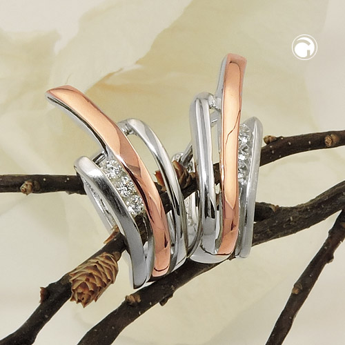 Paire de boucles d'oreilles argent sterling deux tons sur fond blanc